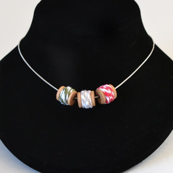 Cute necklace with spools of baker's twine on a chain!
