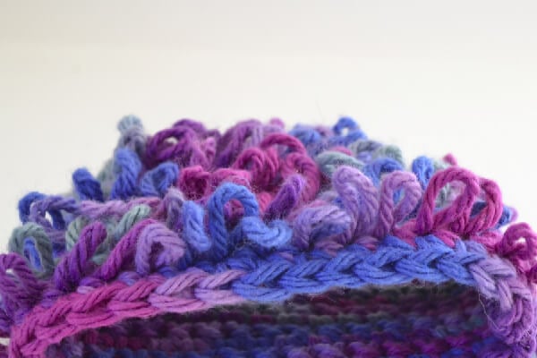 This loop crochet stitch makes a loopy fabric that is too cute. Strands an be cut for a "hairy" look, too!