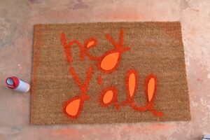 You can make a custom text door mat to say absolutely anything. Hey y'all! So neat!