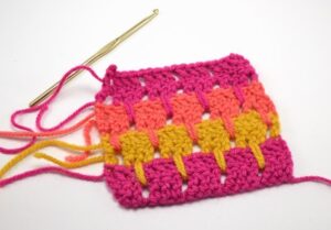 The larksfoot crochet stitch is made up of double crochets and chains. Super easy but lovely pattern.