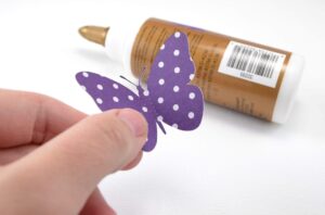 Butterflies pop from the canvas in this fun, DIY wall art!