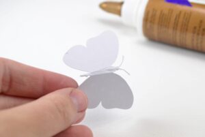 Butterflies pop from the canvas in this fun, DIY wall art!