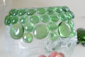 A $1 candle holder and $2 worth of glass gems become something beautiful!