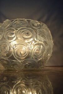 This gorgeously textured swirl candle holder is brilliant when lit! It might surprise you what it's made out of!