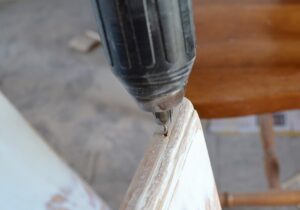 This quick hack makes painting cabinet doors so much quicker. Just grab a metal hanger and let's go! #lifehack