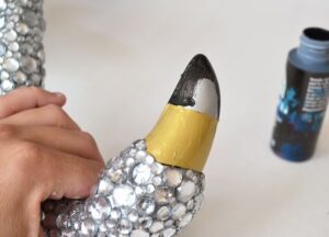 This blinged out flamingo is a totally unique garden accessory you can whip up yourself. You just need the right glue to make it work out!