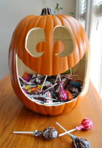 Make the cutest, happiest jack o lantern candy holder. I'm going to have one instead of a plastic bowl when handing out this year!