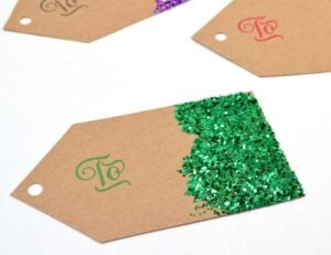 Make gift tags from scratch and save big bucks! Glitter is super cute but you can decorate them any way you please!