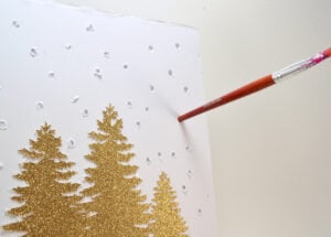 This winter twinkle light display is so pretty! Make your own with bottle brushes, buffalo snow and a shadow box. Full tutorial!