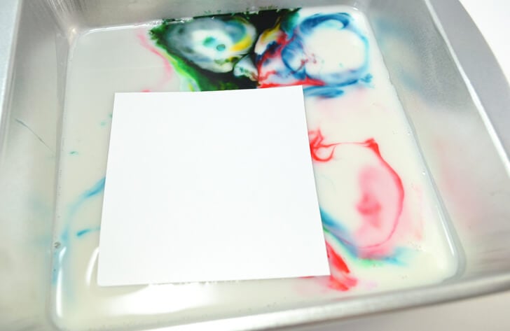 Grab the kids and check out this amazing kid craft. Looks like milk marbling is so cool!