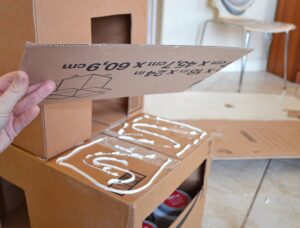 Give kitty something to purr about with their own cardboard cat mansion from upcycled materials!