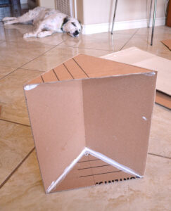 Give kitty something to purr about with their own cardboard cat mansion from upcycled materials!