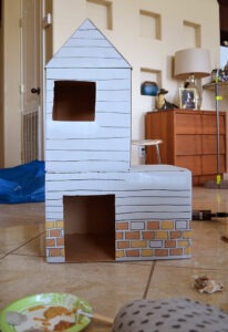 Give kitty something to purr about with their own cardboard cat mansion from upcycled materials!