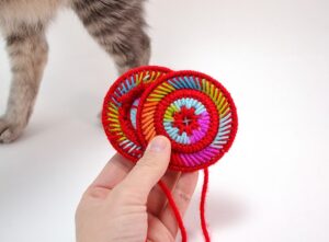 Have trouble holding cards? These plastic canvas playing card helpers are fun to make, cute to look at and keep your hands from cramping while playing gin!