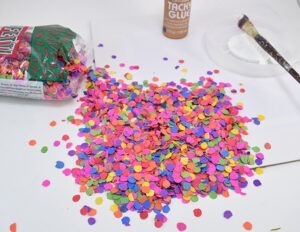 Make confetti wall art to inspire you to be happy or kind! I love this colorful reminder :)