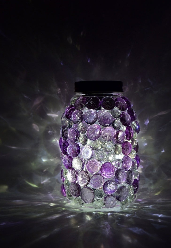 These glittering gem mason jars are a snap to make and so pretty! DIY Solar light lids mean they come on every night, too!