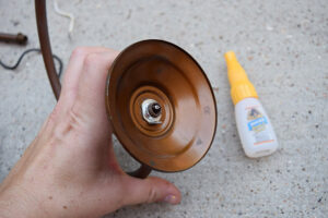 This birdhouse chandlier is a great way to repurpose old lighting! Birds get a new home and the garden gets some quirky color!