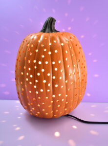 Use a q-tip and orange paint and cover the foam of each drilled hole.