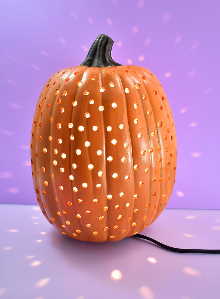 Use a q-tip and orange paint and cover the foam of each drilled hole.
