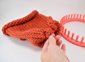 Did you know how easy it is to loom knit a hat? It looks properly knit, too! I'm making a ton as gifts!
