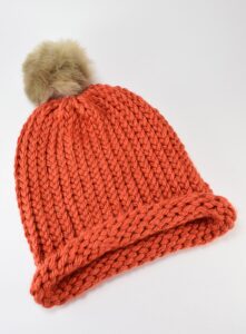 Did you know how easy it is to loom knit a hat? It looks properly knit, too! I'm making a ton as gifts!