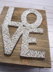 String art is still as hot as ever! Add lights and it's even hotter! Check out this marquee string art tutorial. It looks stunning in the dark!