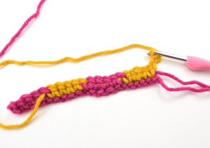 The checkerboard crochet stitch makes a nice, thick fabric and that pattern is amazing. And it's so much easier to do than it looks!