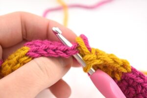 The checkerboard crochet stitch makes a nice, thick fabric and that pattern is amazing. And it's so much easier to do than it looks!