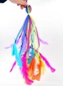 If your kitty loves feathers, and what cat doesn't, she's going to LOVE these DIY feather toys you can make from her. So much sturdier than store bought and cats love homemade!