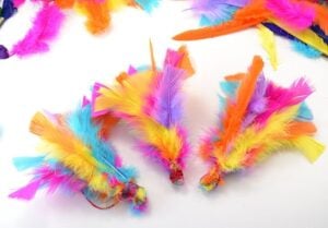 If your kitty loves feathers, and what cat doesn't, she's going to LOVE these DIY feather toys you can make from her. So much sturdier than store bought and cats love homemade!