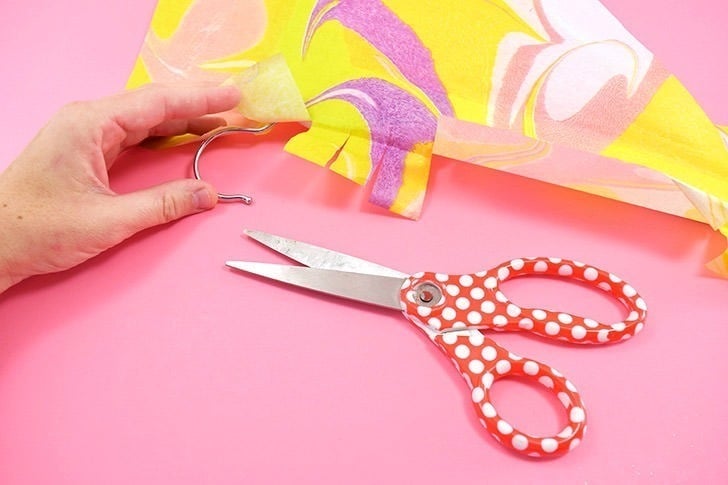 These fancy marbled hangers are actually a super easy decoupage project. Bonus points you don't have to worry about anything coming off on your clothes!