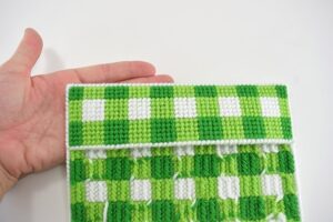 Protect your favorite books with an awesome plastic canvas stitched book cover. It's a great intro to needlepoint project!