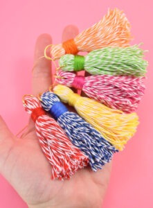 These 5 minute baker's twine tassels are so adorable and cost about 33 cents apiece - seriously why buy when DIY is so cheap?!?