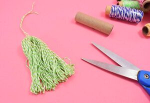 These 5 minute baker's twine tassels are so adorable and cost about 33 cents apiece - seriously why buy when DIY is so cheap?!?