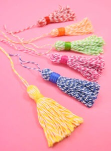 These 5 minute baker's twine tassels are so adorable and cost about 33 cents apiece - seriously why buy when DIY is so cheap?!?