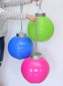 How cool are these DIY giant ornaments? They're simple to make and they fold in on themselves so you can easily store them from year to year!