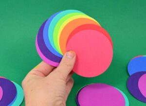 These rainbow paper ornaments are such an easy decoration for a fun and colorful Christmas tree! Make them in minutes and stash bust at the same time!
