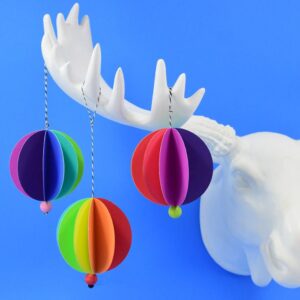 These rainbow paper ornaments are such an easy decoration for a fun and colorful Christmas tree! Make them in minutes and stash bust at the same time!