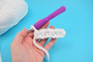 Keep your ears toasty with this inexpensive DIY. This thick and quick pattern whips up the cutest stretchy ear warmer that will fit any size head!