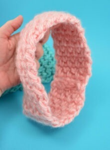 Keep your ears toasty with this inexpensive DIY. This thick and quick pattern whips up the cutest stretchy ear warmer that will fit any size head!