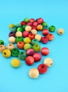 Save your tabletops and counters from unnecessary burns with an easy to make wooden bead trivet. Paint, dye or leave the beads natural to match any kitchen