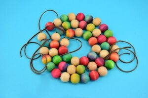 Save your tabletops and counters from unnecessary burns with an easy to make wooden bead trivet. Paint, dye or leave the beads natural to match any kitchen