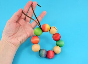 Save your tabletops and counters from unnecessary burns with an easy to make wooden bead trivet. Paint, dye or leave the beads natural to match any kitchen