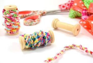 Learn how to turn your scrap material into simple and adorable fabric twine. Make something cute and bust your craft stash at the same time!