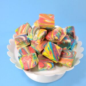 This white chocolate fudge recipe is tinted and marbled to make the prettiest tie dye fudge around! Impress your guests without them knowing you didn't even have to break out the candy thermometer!
