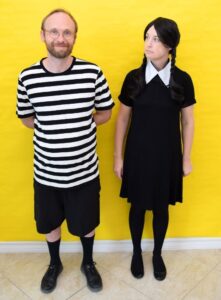 Looking for a cheap and easy couple's costumes? These Addams Family Halloween costumes use common items to turn a pair into Wednesday and Pugsley Addams!