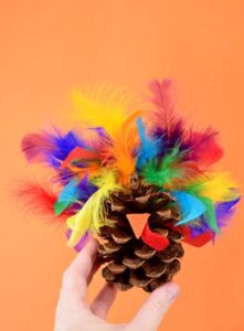 Gobble! Gobble! Decorate your Thanksgiving table with this fun pine cone turkey craft perfect for little hands!