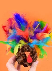 Gobble! Gobble! Decorate your Thanksgiving table with this fun pine cone turkey craft perfect for little hands!