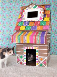 My cat LOVES hiding in boxes. I'm going to make her this gingerbread cat house. All I really need are boxes already in the garage, some paint and a craft knife. LOVE IT!