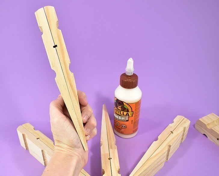 Absolutely massive clothespins make the most perfect, 20 inch giant clothespin snowflakes that will be the glittery envy of all of your holiday guests!